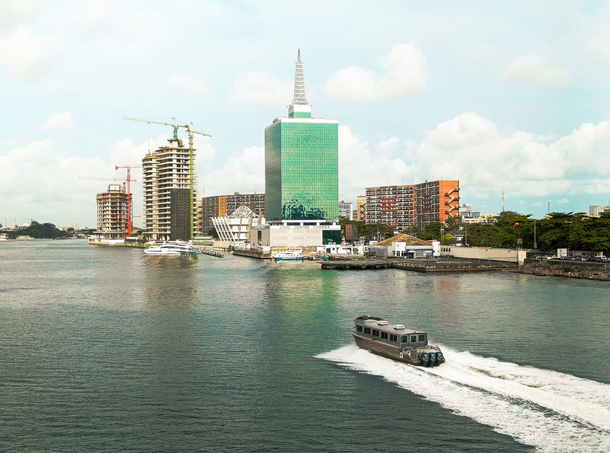 Lagos waterfront with construction cranes rising over Victoria Island